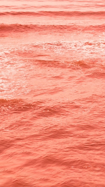 Echtes Foto Meerwasserwellen abstrakter Hintergrund Naturkraft leuchtend orange rot mehr Ton auf Lager