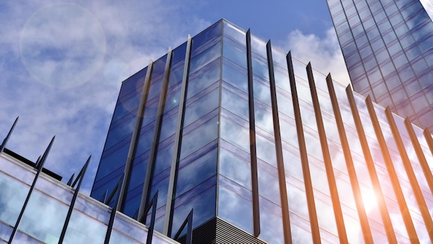 Edificio de oficinas moderno con fachada de vidrio sobre un fondo de cielo despejado Pared de vidrio transparente