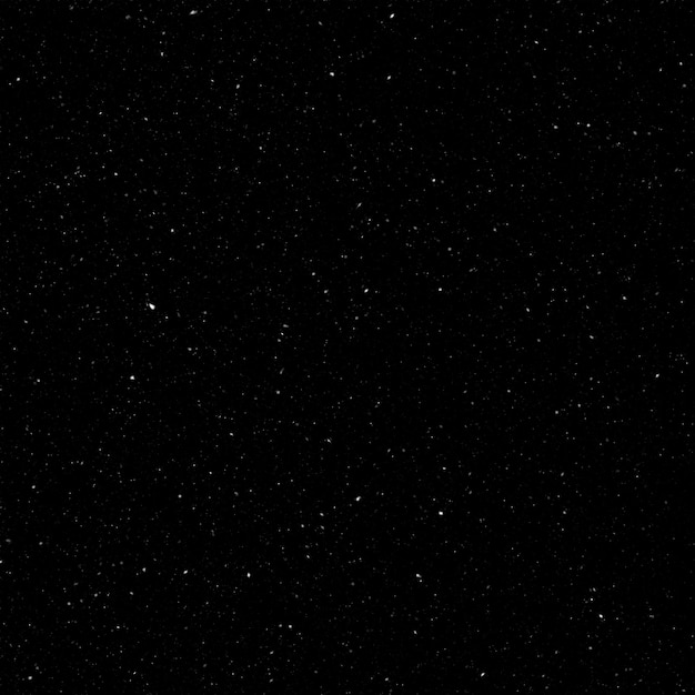 Efecto de textura de nieve blanca natural aislada en el fondo de la noche negra