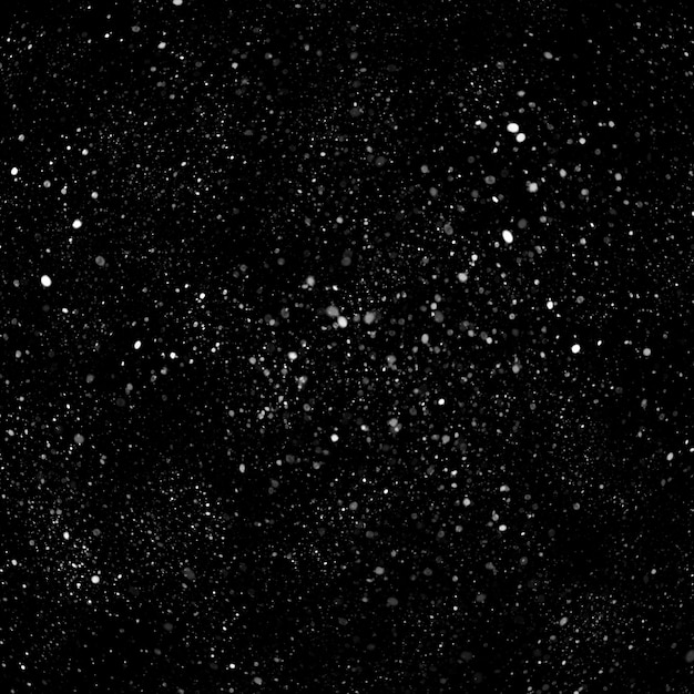 Efecto de textura de nieve blanca natural aislada en el fondo de la noche negra