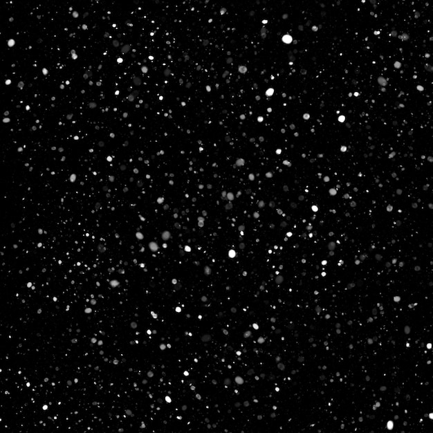 Efecto de textura de nieve blanca natural aislada en el fondo de la noche negra