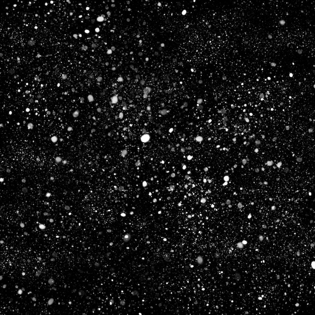 Foto efecto de textura de nieve blanca natural aislado sobre fondo de noche negra