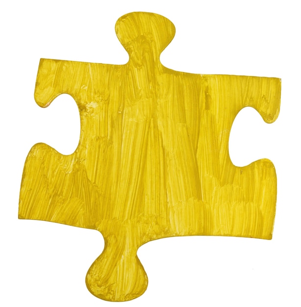 Ein gelb bemaltes Papierstück Puzzle