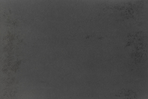 Ein grauer Handwerkshintergrund aus schwarzem Papier