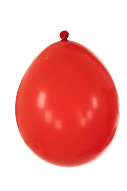 Ein roter Ballon vor weißer Oberfläche