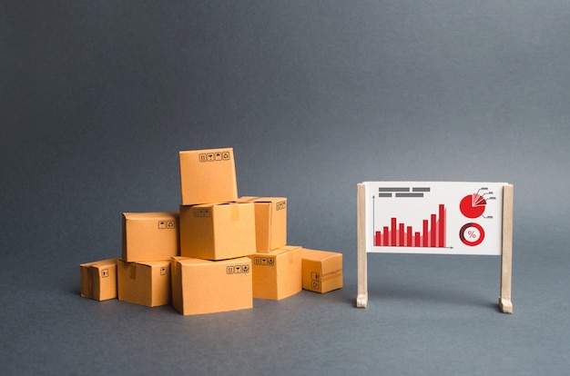 Ein Stapel Pappschachteln und ein Stand mit Informationen und statistischen Diagrammen. berichte über die rate