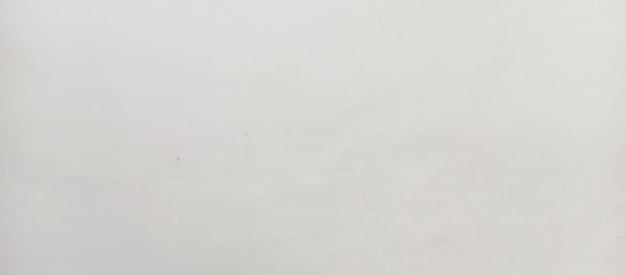 ein weißer Hintergrund mit ein paar kleinen Punkten