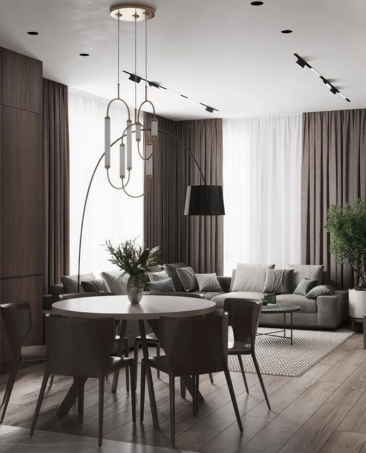 Foto ein zimmer mit einem sofa, stühlen und einem tisch mit einer lampe