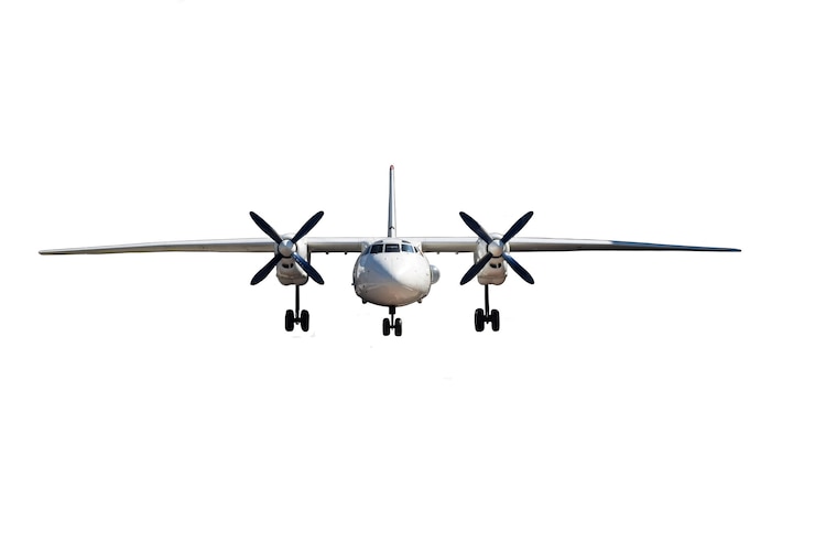 Foto ein zweimotoriges passagierflugzeug auf einem sauberen weißen hintergrund, fotografiert von vorne.