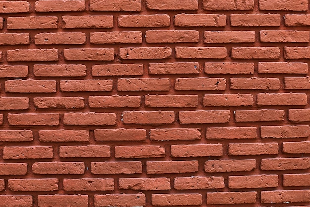 Eine Backsteinmauer mit einer roten Backsteinmauer.
