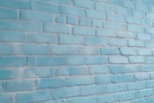 Eine blaue Ziegelwand mit einem weißen Schild mit der Aufschrift „blauer Ziegelstein“