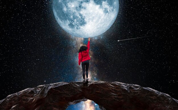 Foto eine frau meditiert vor dem mond