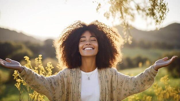 Foto eine frau mit einem natürlichen afro steht in einem blumenfeld