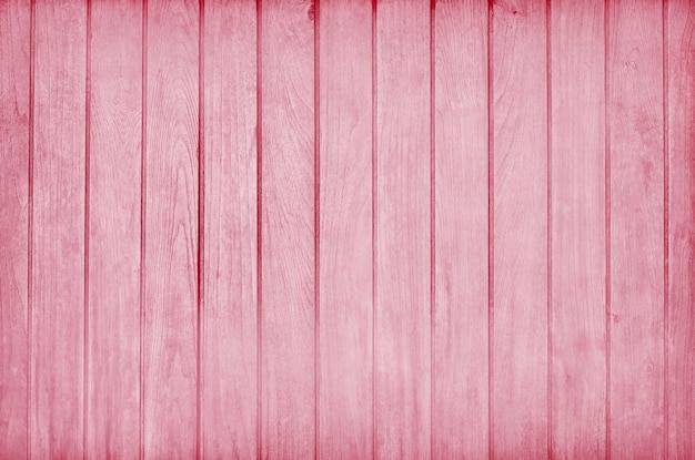 Eine Holzwand in rosa Farbe gemalt