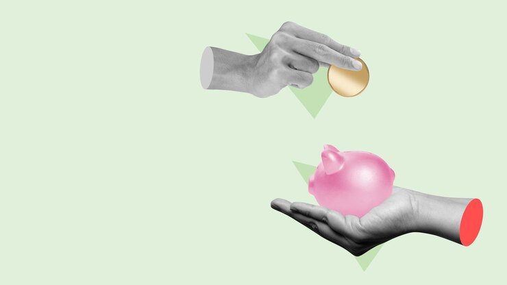 Foto eine menschliche hand steckte eine goldene dollarmünze in ein sparsammel