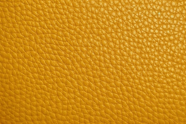 Eine Nahaufnahme einer gelben Lederstruktur mit Rautenmuster.