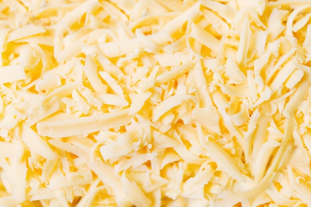 Foto eine nahaufnahme eines haufens geriebenen käses