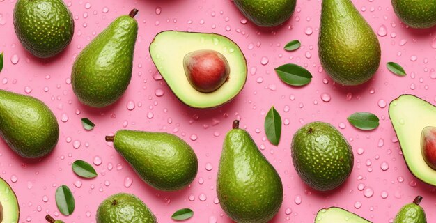 Foto eine nahaufnahme von avocados auf einer rosa oberfläche mit generativen wassertropfen