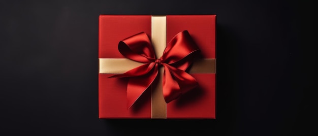 Eine rote Geschenkbox mit goldenem Band und Schleife mit leerem Hintergrund für Kopierraum. Generative KI