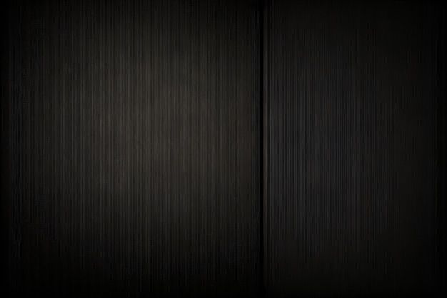 Eine schwarze Wand mit einem schwarzen Türhintergrund für den Desktop