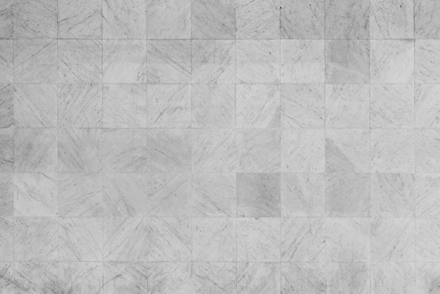 eine Wand aus Fliesen mit einer rauhen Textur