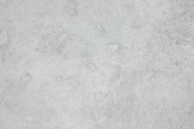 Foto eine wand, die mit grauem gips-hintergrund bedeckt ist