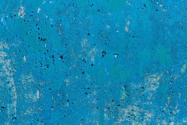 Einfarbig blau lackierte flache Betonoberfläche Nahaufnahme Textur