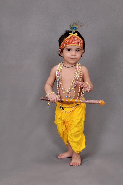 Einjähriger Junge Krishna mit Flöte Janmastmi