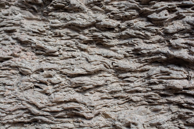 Einzigartiges Muster der Steinoberflächenstruktur als Hintergrundfelsenbeschaffenheit