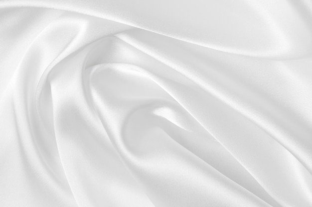 Elegancia seda satinada blanca con ondas fondo abstracto tela de lujo elegante diseño de papel tapiz Fondo abstracto tela de lujo u onda líquida