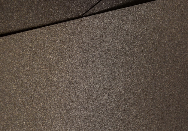 Elegante textura de papel marrón con un acabado dorado brillante y un efecto brillante sutil rico y