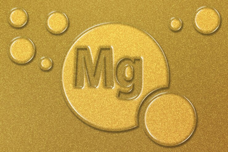 Foto elemento mg magnesio mineral vitamina complejo suplemento dietético fondo dorado