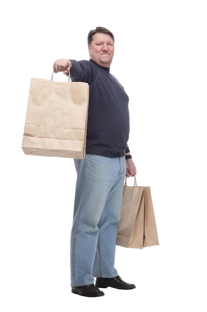Em pleno crescimento. homem maduro casual com sacolas de compras.