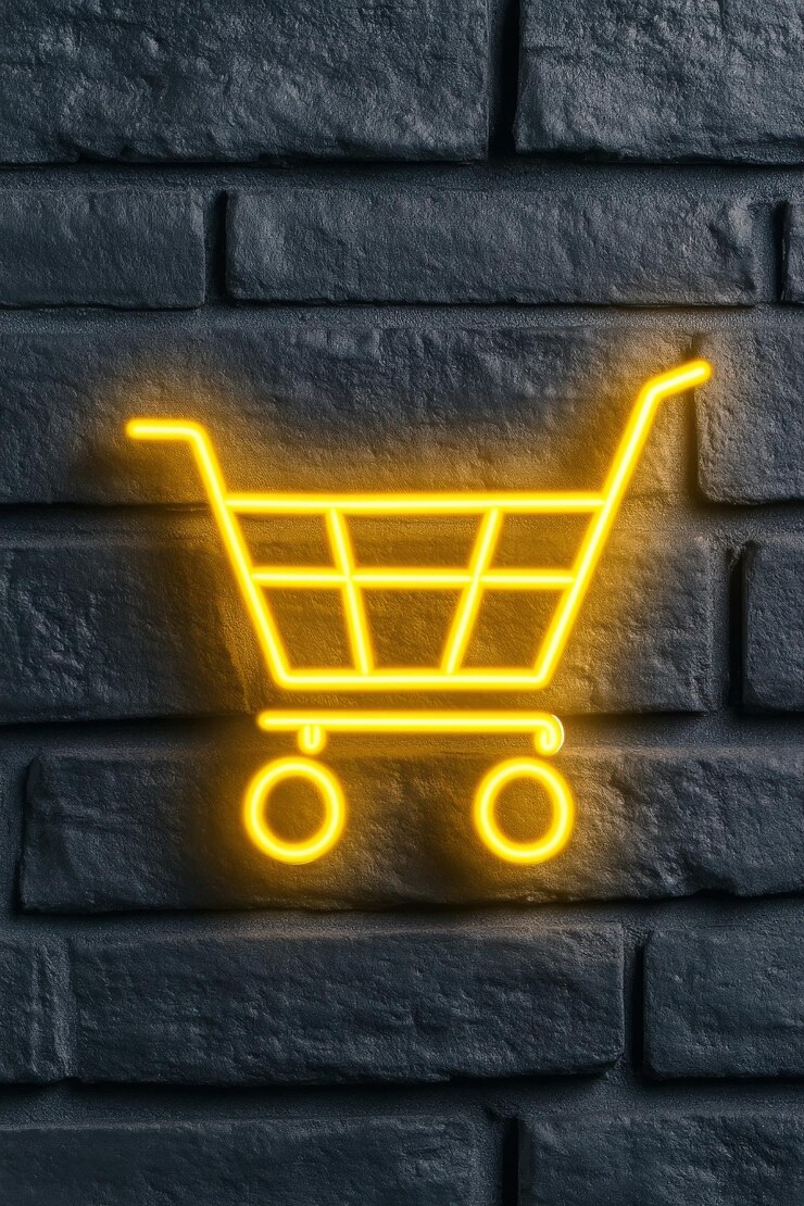 Foto emblema de carrito de compras de neón brillando en una pared de ladrillo texturizado en un entorno urbano