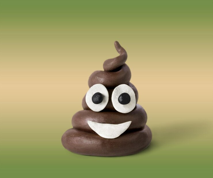 Foto emoticon de cocô em fundo rosa