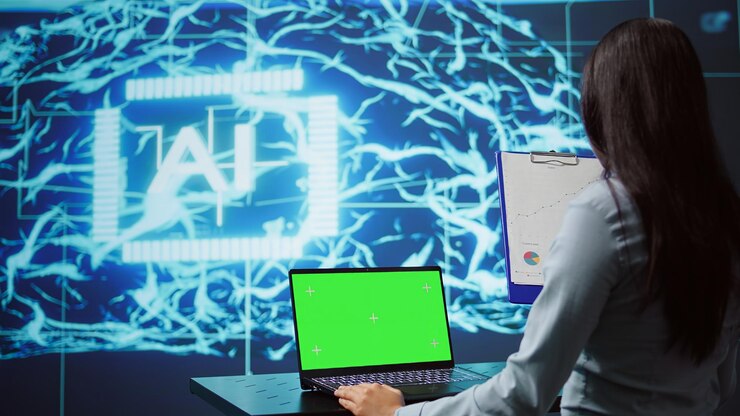 Foto empleado de una startup mirando gráficos usando software de ia en una computadora portátil de pantalla verde