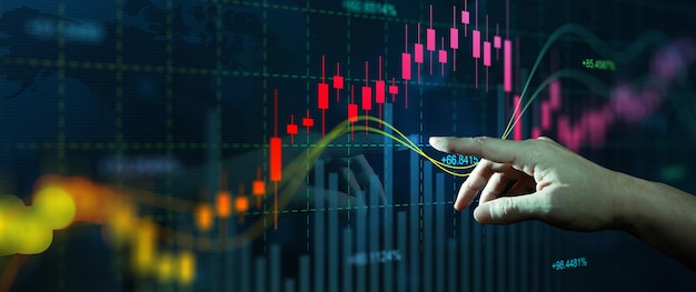 Empresário dedo toque símbolo estoque gráfico e gráfico com castiçal de negócios. negociação online