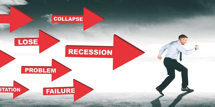 Foto empresario huyendo de la crisis y la recesión