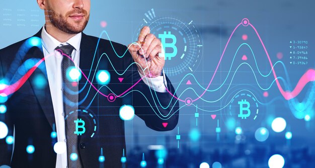 Empresario con pluma de dibujo en el gráfico financiero digital bitcoin gráfico