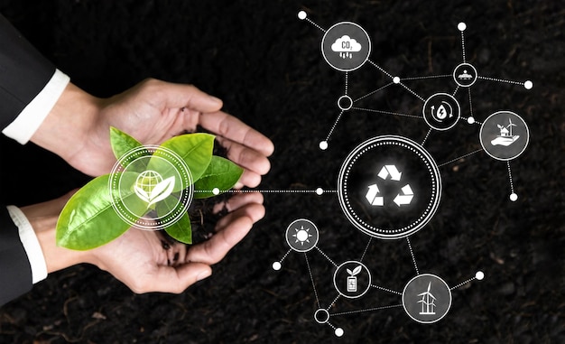 Empresario que nutre y cultiva plántulas de plantas con símbolo de reciclaje Compromiso empresarial e inversión en la protección natural y ambiental futuro ecosistema sostenible Panorama Reliance