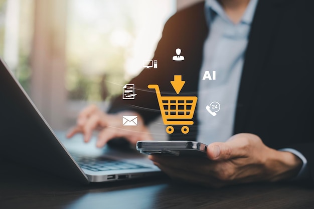 Empresario que utiliza una computadora portátil con concepto de compras en línea sitio web de mercado con interfaz virtual de carrito de compra en línea parte de la red negocio de compras en Internet con la selección de carreto de compras