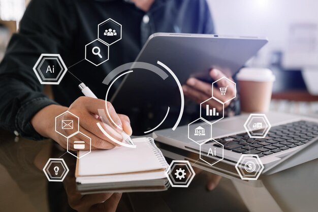 Empresario que utiliza un teléfono móvil y una computadora portátil con el concepto de inteligencia empresarial