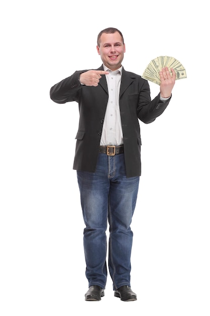 Empresario sonriente en jeans con dinero en dólares mostrando los pulgares hacia arriba