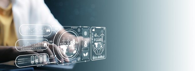 Empresario usando portátil con energía alternativa para el concepto futuroTurbinas eólicas cambian el viento