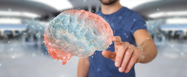 Empresario utilizando proyección digital 3D de un cerebro humano