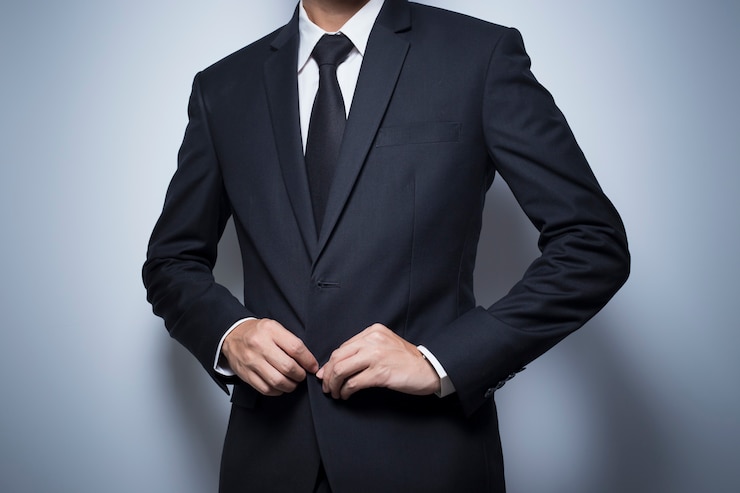 Foto empresario vistiendo un traje negro