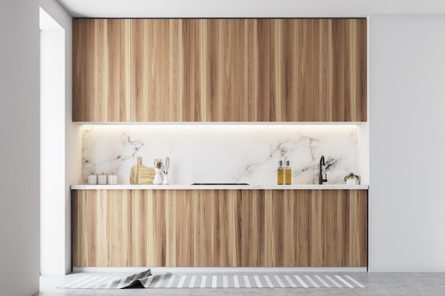 Encimeras de cocina de madera con electrodomésticos integrados en un interior de cocina blanco con suelo de hormigón. maqueta de renderizado 3d