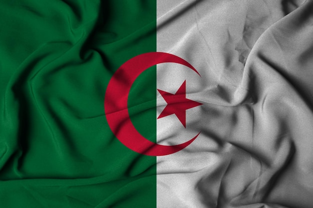 Foto enfoque selectivo de la bandera de aljazair, con textura de tela ondeante. ilustración 3d