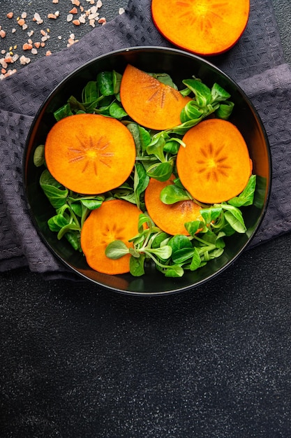 ensalada de caqui ensalada de lechuga verde comida fresca bocadillo en la mesa espacio de copia fondo de alimentos