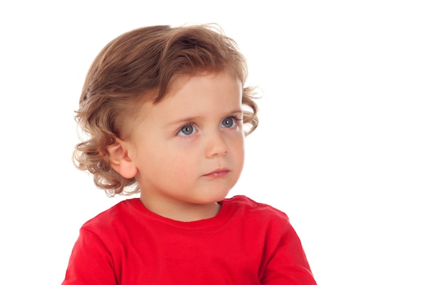 Entzückendes Baby mit dem lockigen Haar